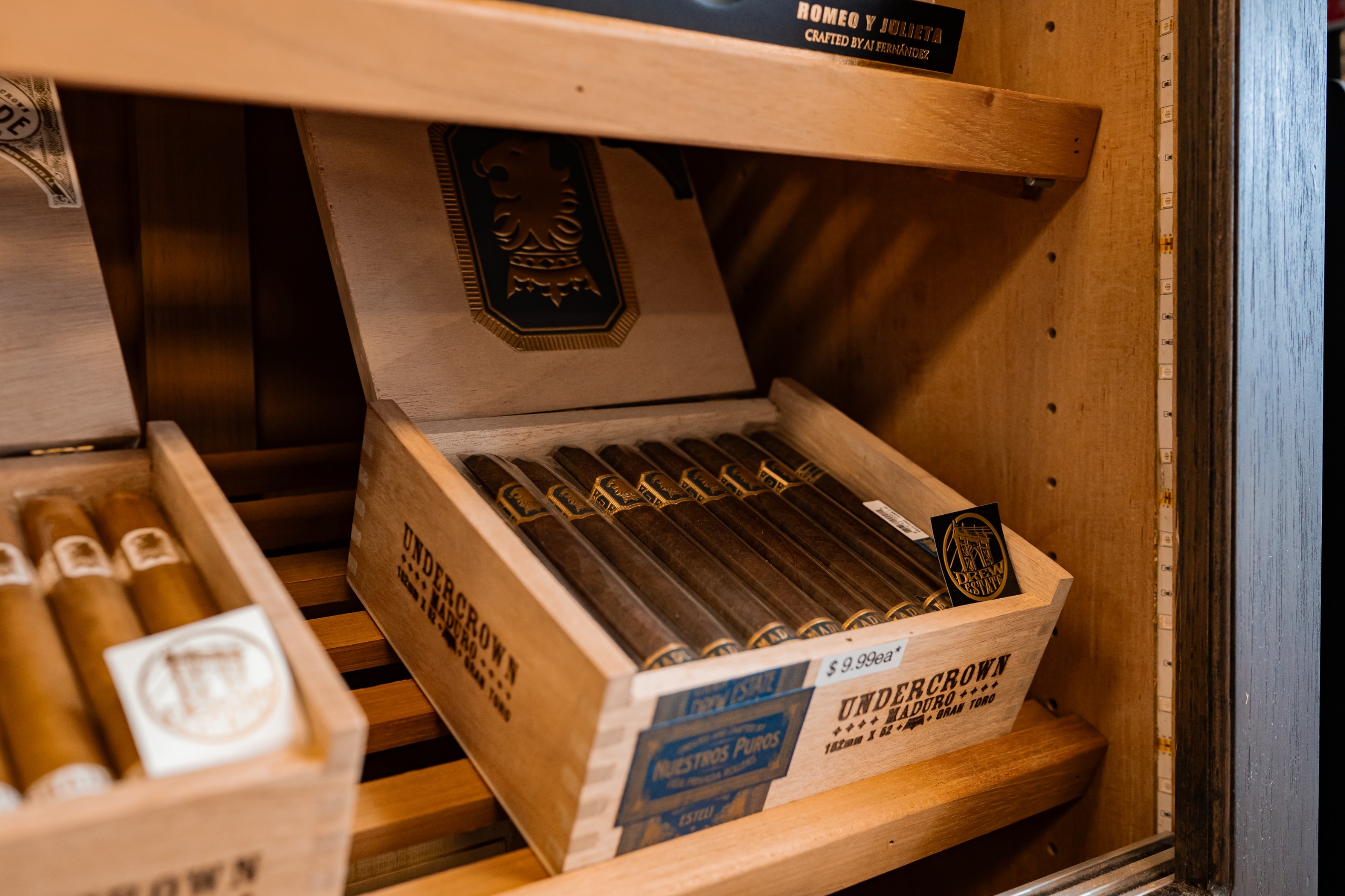 Close-up of premium cigars in a wooden box