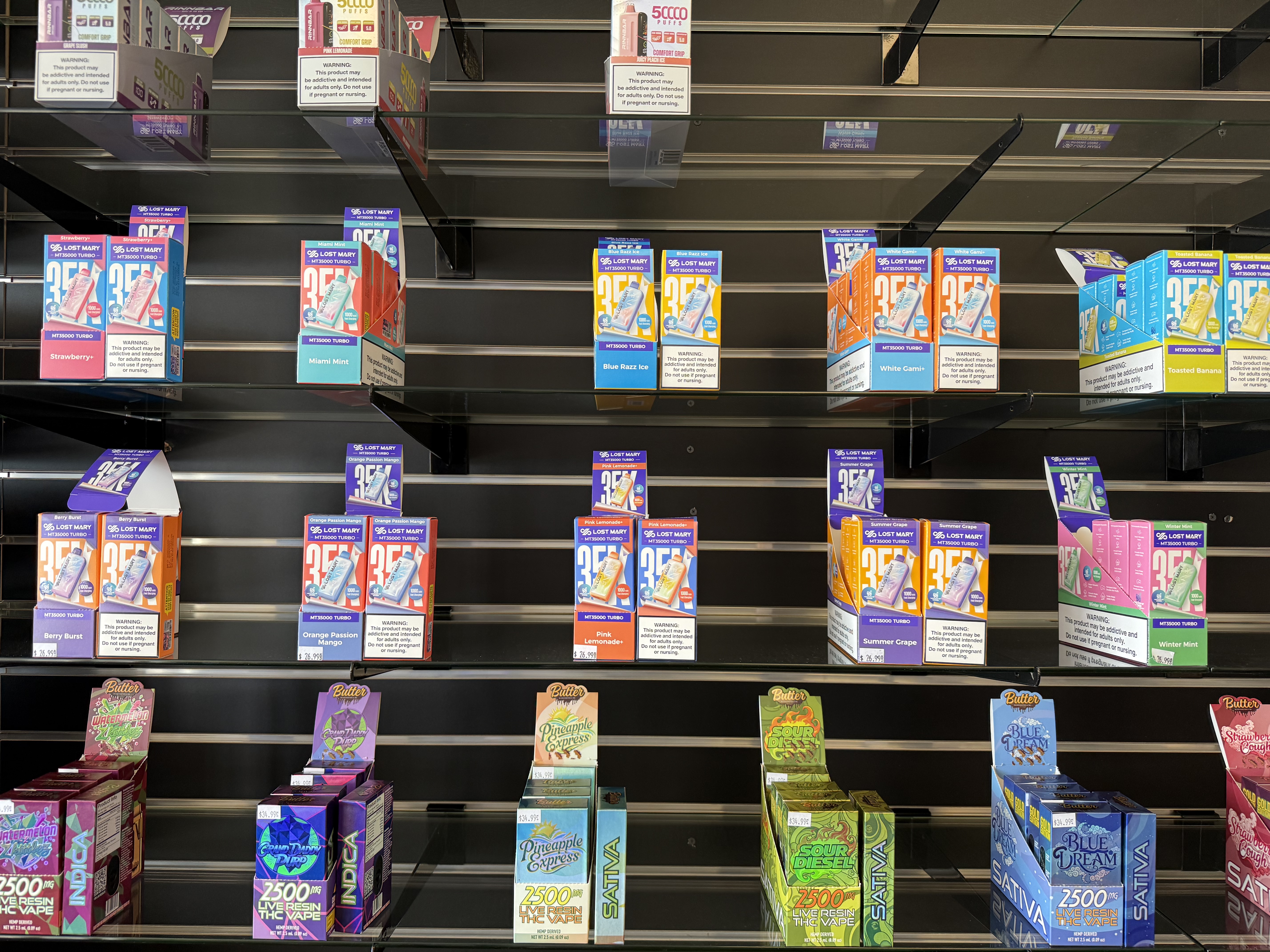 Vape products displayed on glass shelves