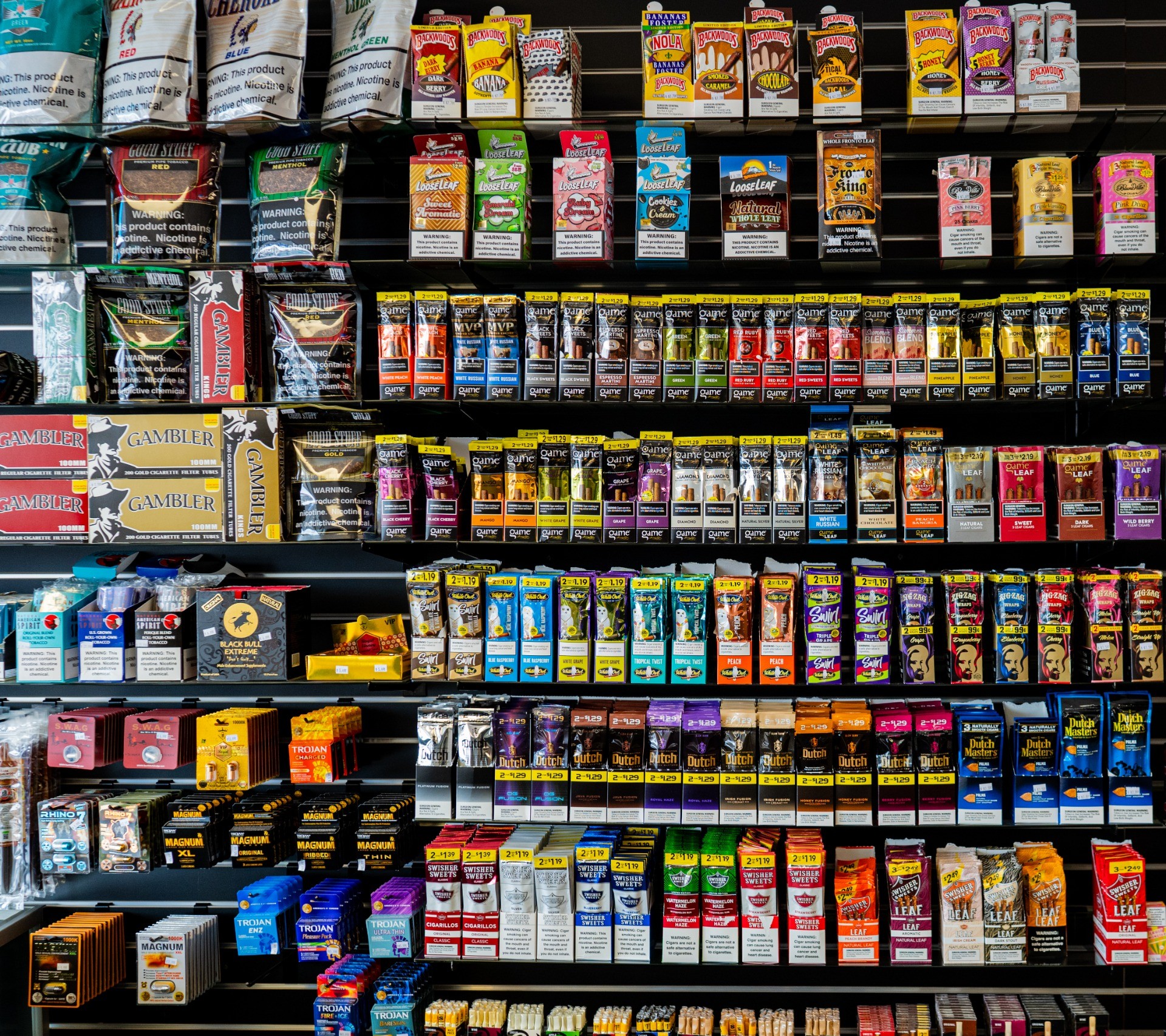 Wall display of tobacco wraps, rolling papers, and cigarillos